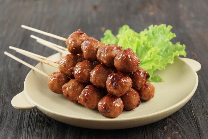 Grilled Meatball in Skewer with Soy and Chilli Sauce.