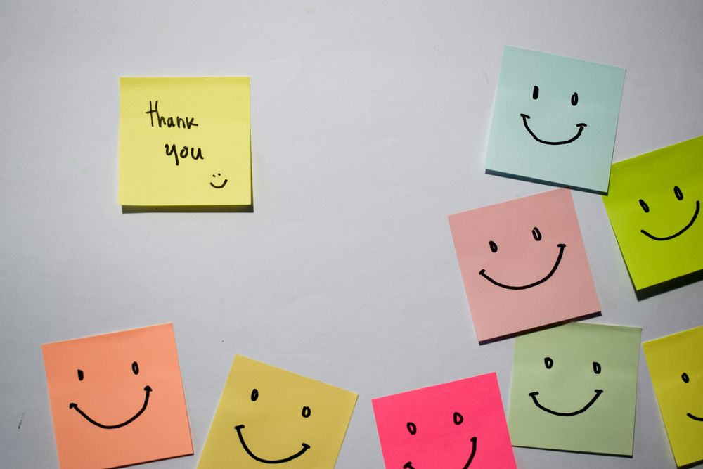 Thank you and smile emoticon on sticky notes