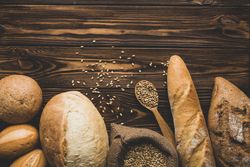 Assortment bread loaves on wooden board