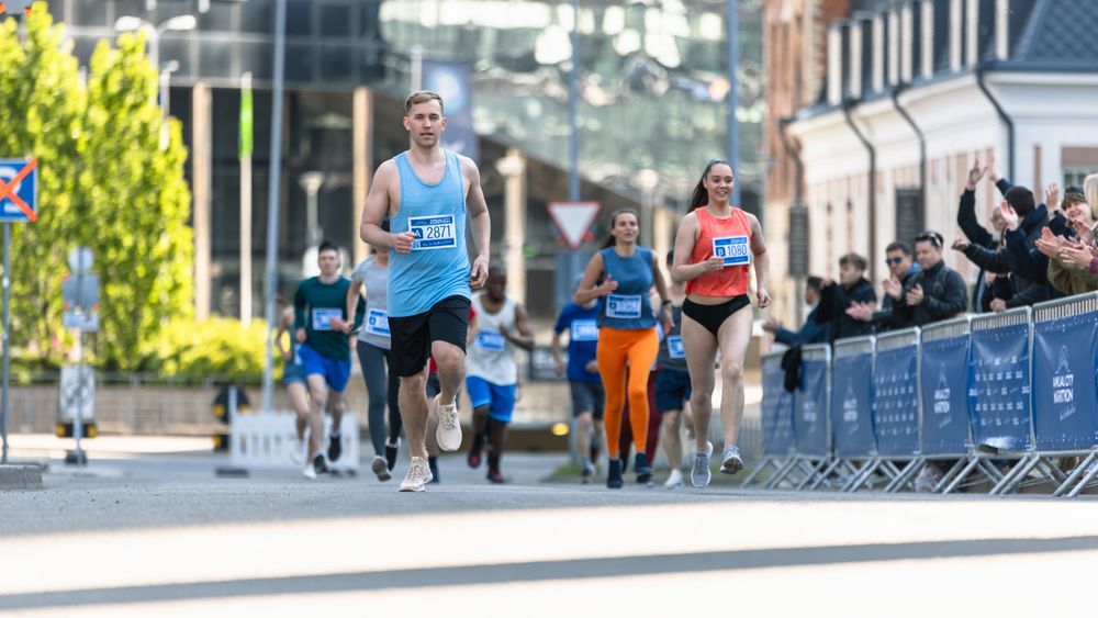 Smiling Group of People Participating in a City Marathon.