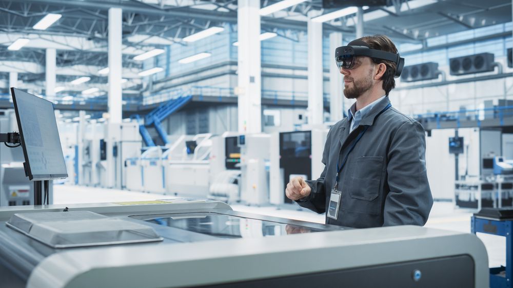 Male scientist doing research in lab in goggles