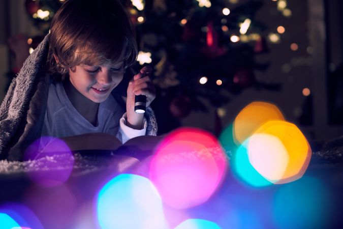 Happy boy reading boy bear garlands