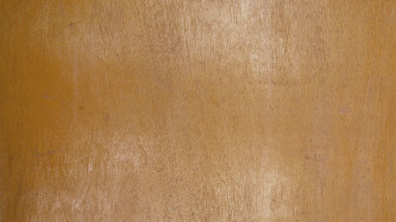 Polished light brown wooden surface with fine natural grain texture