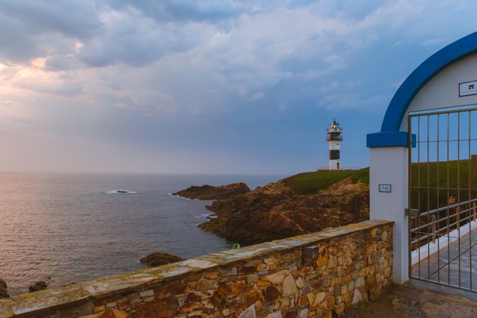 Amazing lighthouse on cliff near sea