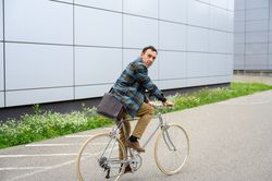 Young man riding bicycle