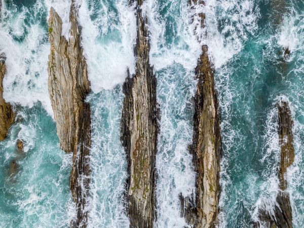 Stone ridges on high seas in stormy day