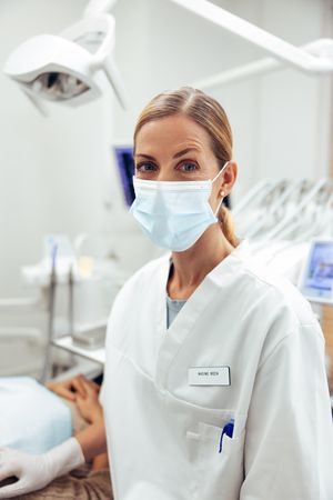 Portrait of a female dentist looking at camera