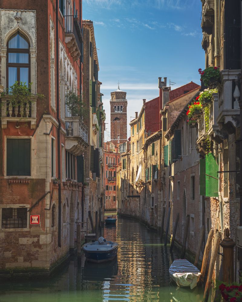 Venice cityscape, water canal, bell tower and traditional buildings, Italy