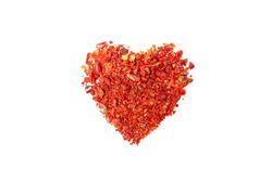 Heart made of pepper powder spice isolated on blank background