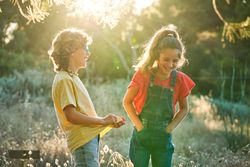 Children laughing together in nature