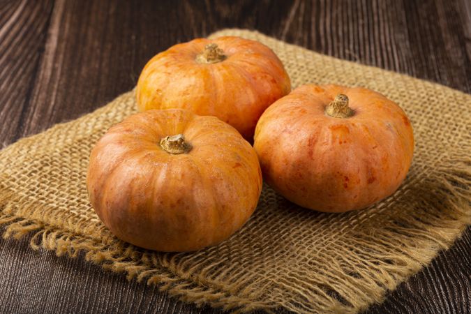 Pumpkins on the wooden table.