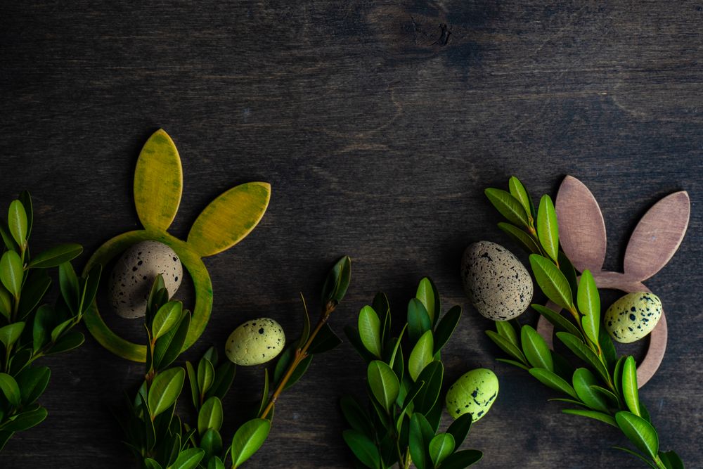 Easter card concept with eggs among leafy branches