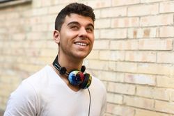 Portrait of young man smiling with headphones