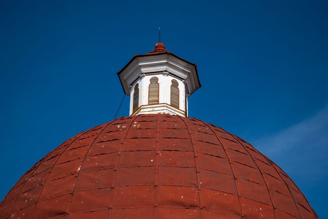 A Big red dome of church in Kota Lama, Semarang City, Indonesia. Vintage historical church blue sky background