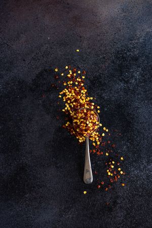 Measurement spoon filled with chili flakes