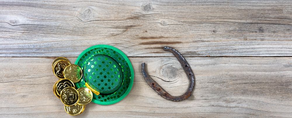 Traditional lucky St Patrick objects on rustic wood