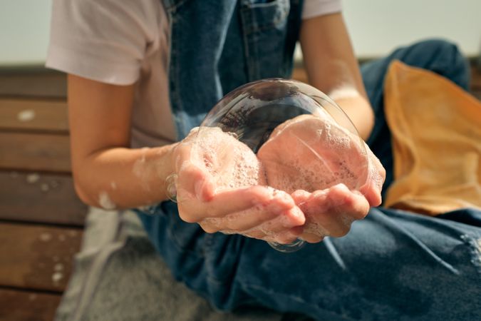 Anonymous kid with soap bubble