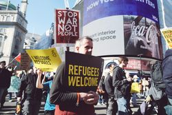 London, England, United Kingdom - March 19 2022: Anti-racism protestors in Picadilly Circus