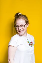 Blonde woman posing in wall