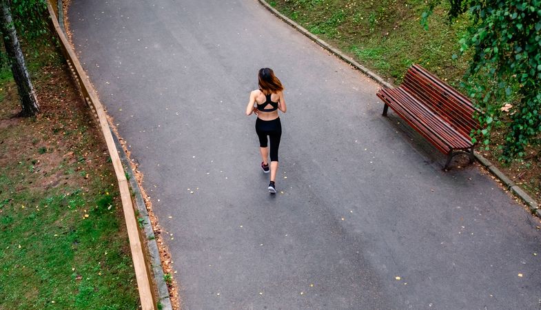 Aerial view of female runner backwards