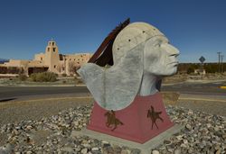 Craig Dan Goseyun’s "Follows the Mountain” sculpture in Santa Fe Community College 5Q8W90