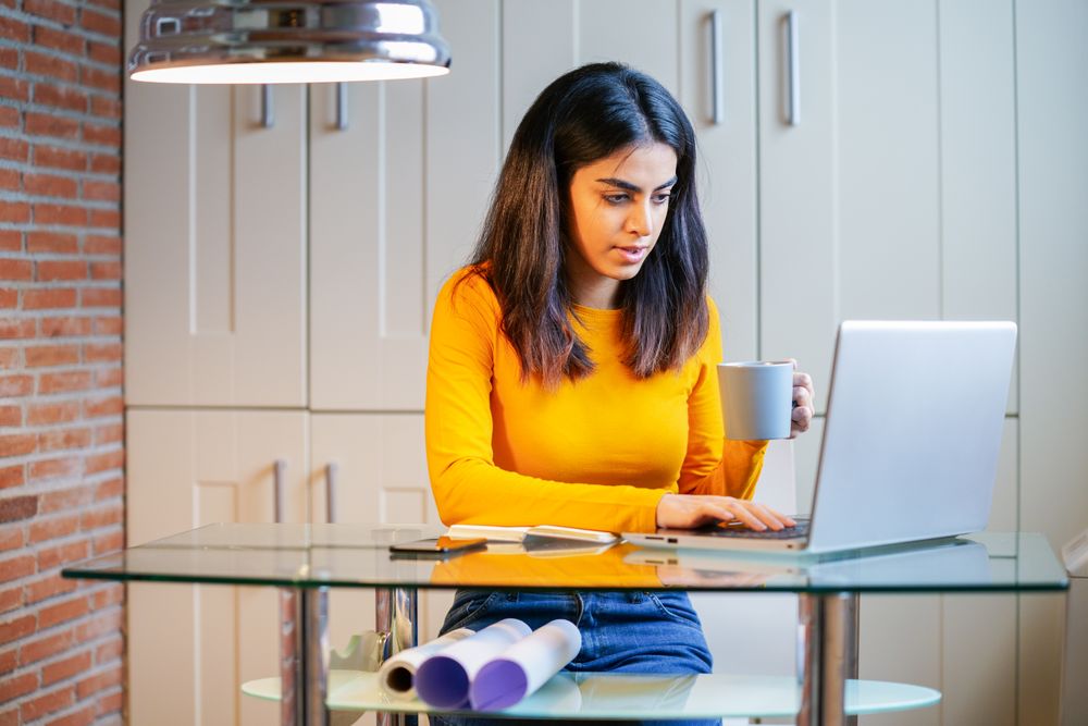 Woman of Persian descent working at home as an architect