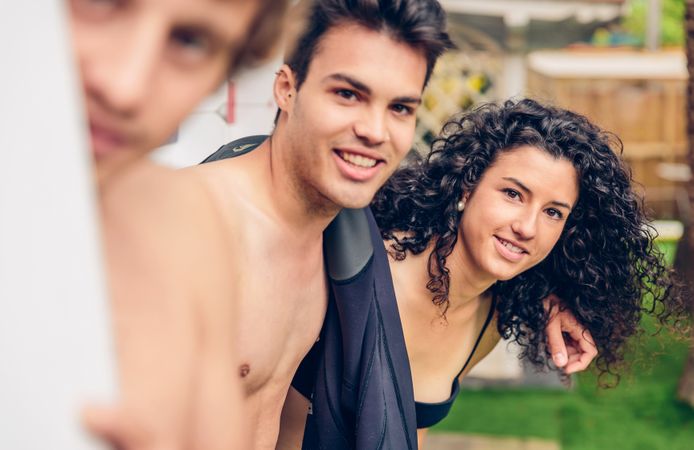 Group of people in swimsuit having fun in backyard