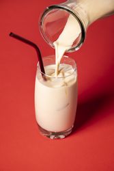 Pouring full glass of horchata