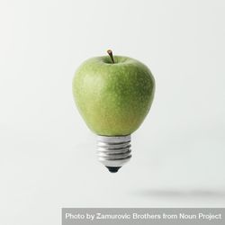 Apple lightbulb on light background 0PMaO5