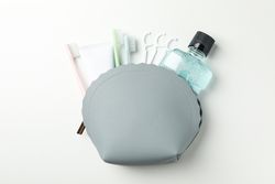 Bag with tools for dental care on light background