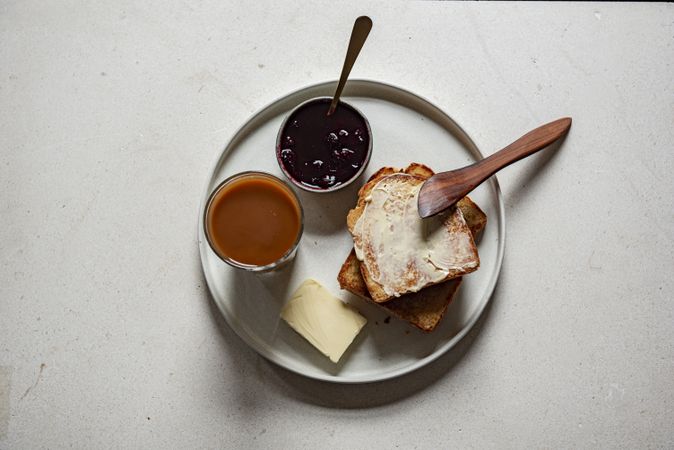 Top view of toast and jam on a plate