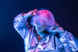 Woman dancing while listening to music