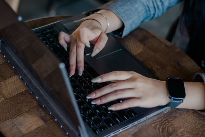 Digital Productivity: Woman Typing on Laptop
