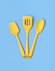 Yellow kitchen utensils on a blue table