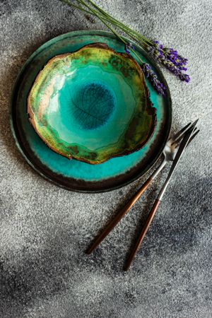 Top view of ceramic teal bowl & plate with lavender