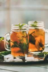 Orange cocktails in mason jars with garnish