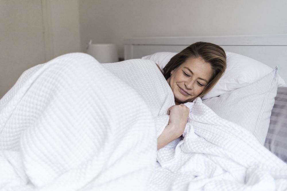Portrait of a comfortable female sleeping in bed