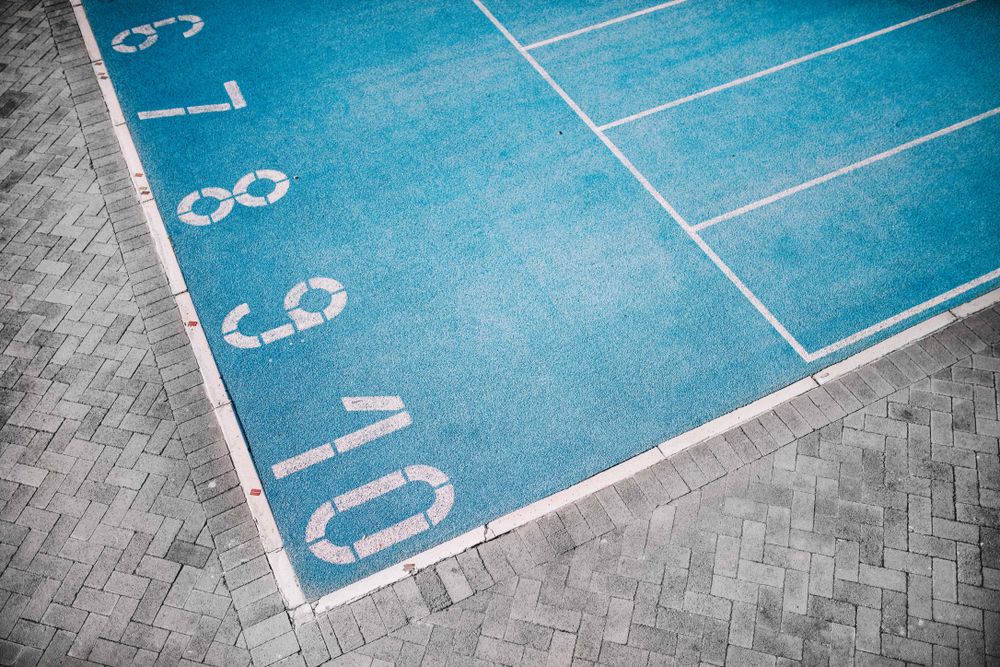 Detail shot of lane numbering on a track field