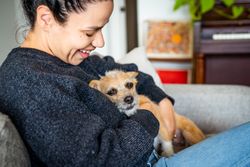 Woman holding cute small dog