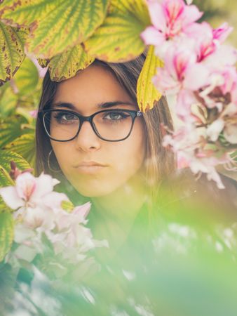Woman on background of stunning violet flowers