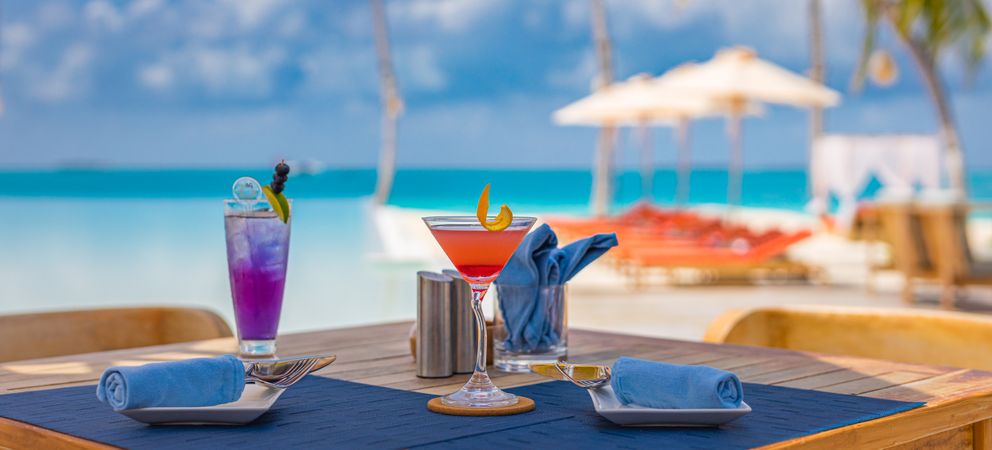 Wide shot of cocktails on the beach