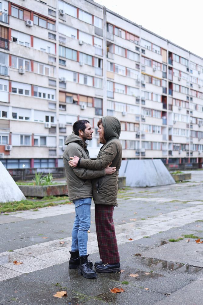 Happy white couple holding each other