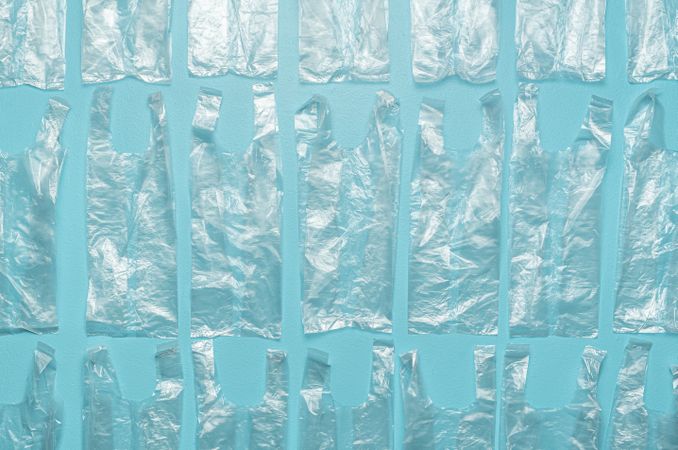 Plastic bags aligned on a blue background