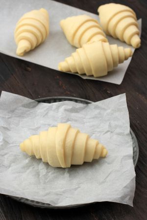 Proofed Croissants Over Nonstick Baking Sheet