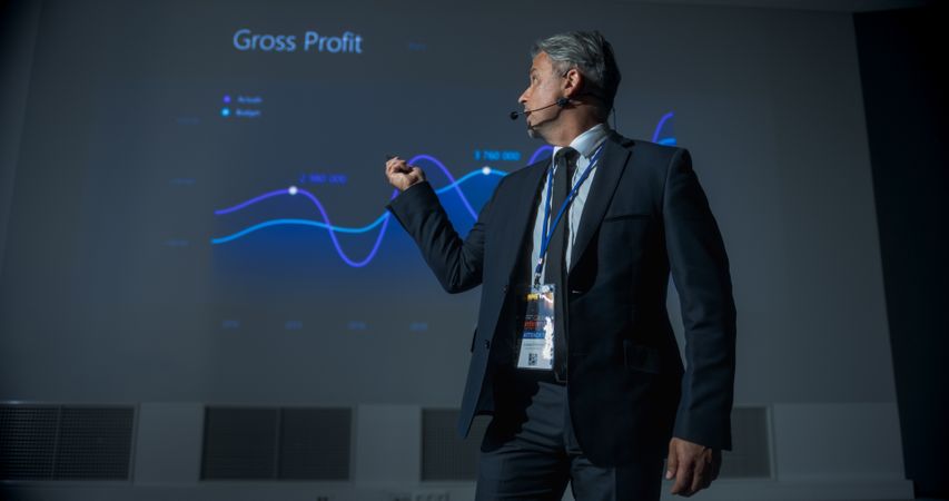 Successful Man Reporting On Revenue Growth and Business Objectives