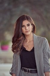 Stylish woman standing on street