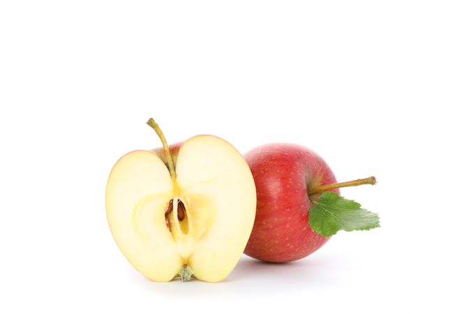 Sweet red apples isolated on light background