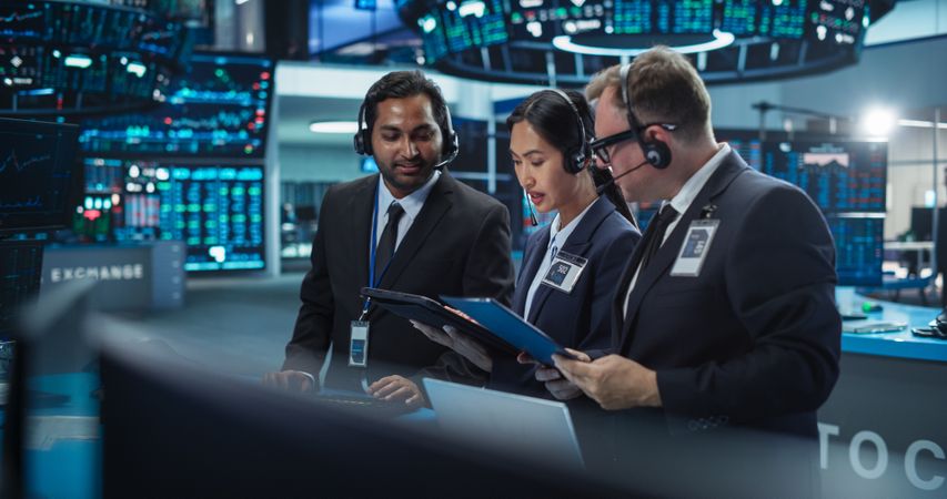 Team of Multiethnic Male and Female Traders Working in a Modern Stock Exchange Company.