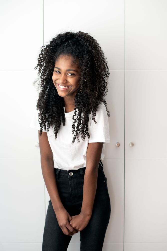 Portrait of a beautiful young Black teenage girl looking into camera