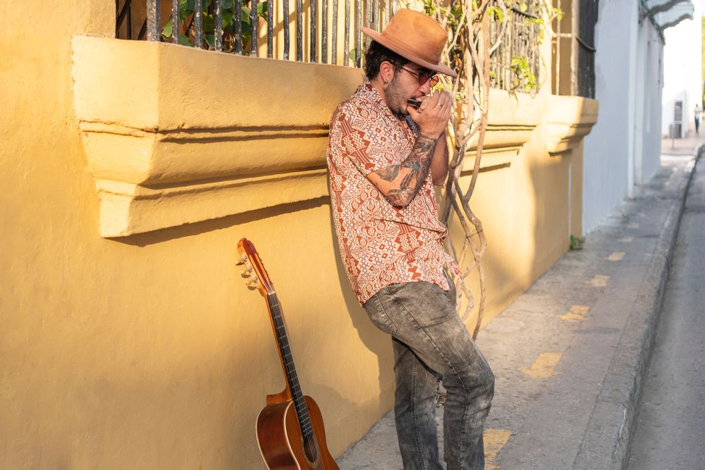 Young Man Playing Music On The City Streets